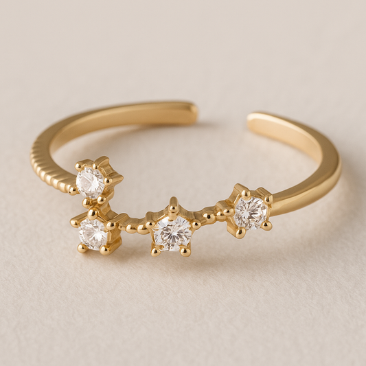 9ct gold 4 star celestial ring with cubic zirconia stones in the middle of each star 